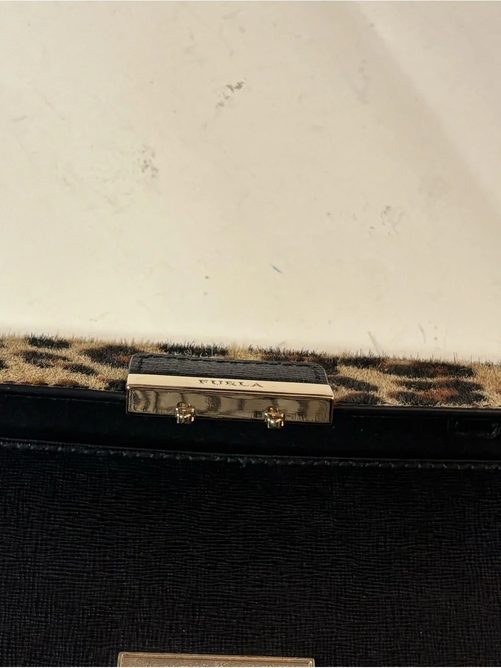 Furla Bella mini crossbody with leopard print calf hair and leather. Adjustable